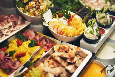 Chef preparing food at live action station during catered reception